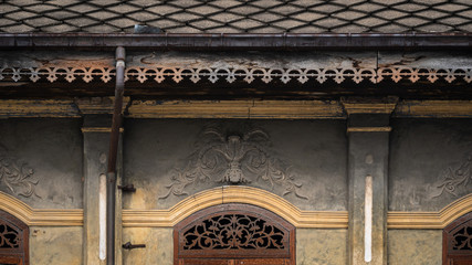 Beautiful ancient wooden stencil engraving windows and stucco pattern with and old yellow...