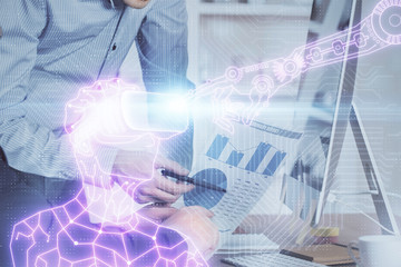 Fototapeta premium AR hologram with man working on computer on background. Augmented reality concept. Double exposure.