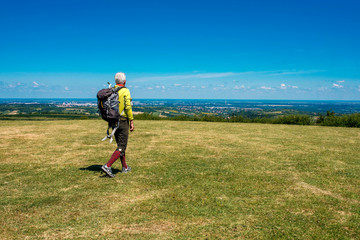 Portrait of senior man on hike in beautiful countryside