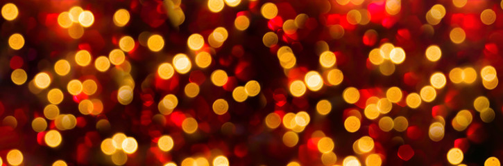 Abstract red Christmas background banner with golden bokeh lights