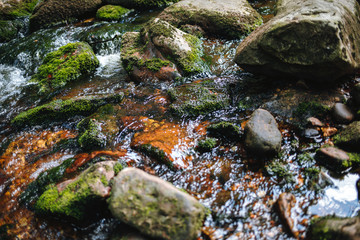 water of the river Weißer Main flows through a creek bed with stones in the Fichtelgebirge