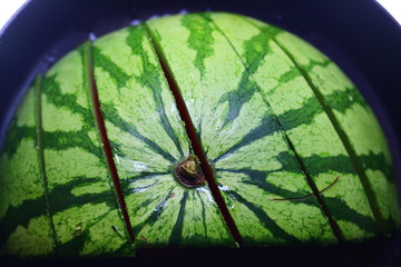 Sliced water melon in a cast iron skillet