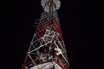 Metal tower transmitter of radio and TV signals, equipment for mobile communication