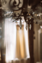 antique metal chandelier and wedding dress