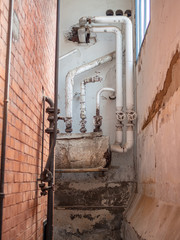 Old pipeline inside of an old abandoned factory