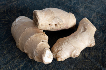 Fototapeta premium Chinese common seasoning plant fresh ginger. Ingredient for healthy hot drink, tea with ginger.