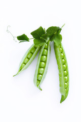 Open pod of green peas on a white background.  Isolated. Closeup. Top view.