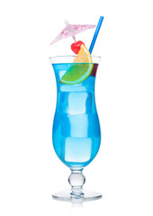 Blue lagoon cocktail classic glass with straw and orange slice on white. Sweet cherries on cocktail umbrella with ice cubes.