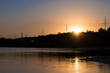 Fototapeta na wymiar Power lines against the background of sunset