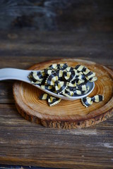 Colorful Italian pasta background. Various colors of bow tie farfalle pasta. Selective focus. Bow noodles