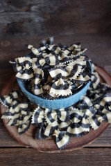 Colorful Italian pasta background. Various colors of bow tie farfalle pasta. Selective focus. Bow noodles