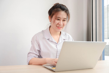 Beautiful Attractive Asian woman working with computer laptop and thinking to get ideas and requirement in Business startup feeling so happiness,Business Startup Concept