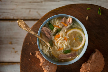 Italian soup with risoni pasta vegetables and chicken,top view