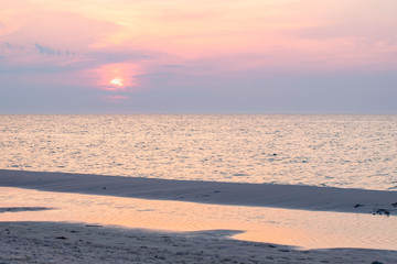 Beach, sunset over waves of Baltic Sea, Poland,