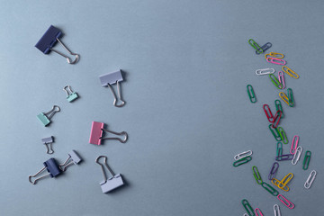 different stationary items on the blue background. minimalism. flat lay