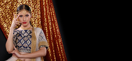 Fototapeta premium India Traditional costume Wedding bride dress on Beautiful Woman Portrait