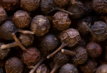 super macro shot of of dried exotic pepper from Java island and from Sumatra in detail very close. Ideal food spice background