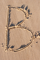 B - Alphabet letter written on sand 