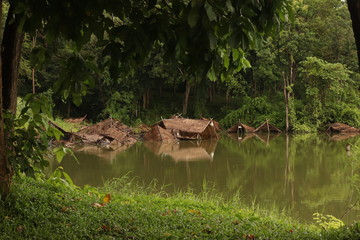 A hut that is sinking in the water
