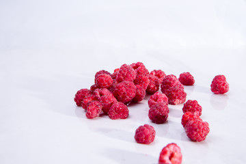 Red raspberry on a white background