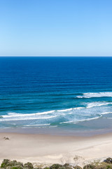 Fototapeta na wymiar Tropical sandy beach with foamy sea waves