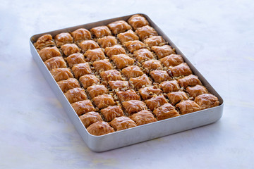 Baklava with walnut standing on the tray