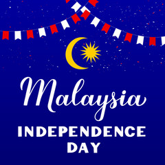 Malaysia Independence Day calligraphy hand lettering with flags on blue background. National holiday celebrated on August 31. Vector template for typography poster, banner, greeting card, flyer, etc