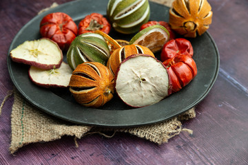 Beautiful food portrait of Wnter seasonal dried fruits with old vintage texture background and cutlery and accessories