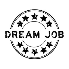 Grunge black dream job word with star icon round rubber seal stamp on white background