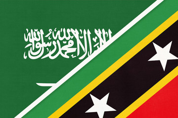 Saudi Arabia and Saint Kitts and Nevis, symbol of national flags from textile. Championship between two countries.