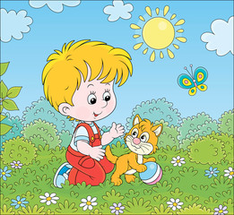 Obraz na płótnie Canvas Smiling little boy playing with a small kitten among flowers on green grass of a lawn on a sunny summer day, vector cartoon illustration