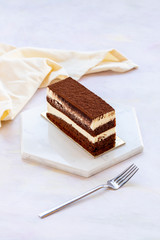 tiramisu cake on white wood