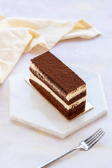 tiramisu cake on white wood