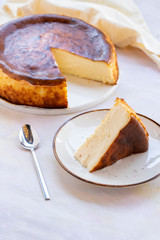 San Sebastian Cheesecake on White Wood