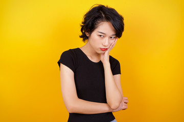 Gloomy young sad asian blond girl sighing upset stoop look from under forehead lonely unhappy lean palm bored feel regret sadness moody expression standing white background pessimistic