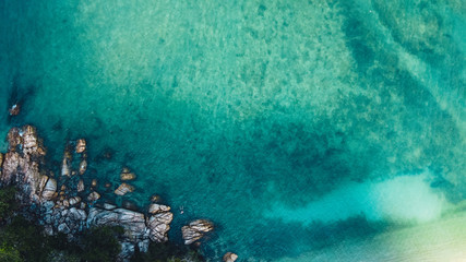Beach and bright blue sea, high angle view