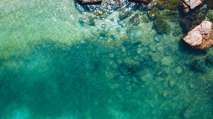 Beach and bright blue sea, high angle view