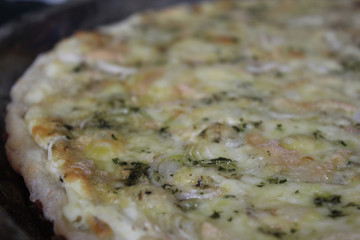 white pizza with bacon and green onions