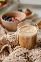 Breakfast with granola, coffee and cakes