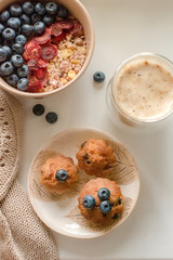 Breakfast with granola, coffee and cakes