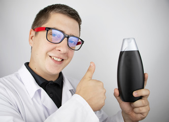 A laboratory technician tests the shampoo for toxins, sulfates and other carcinogenic additives. The shampoo was found to be harmless and environmentally friendly. Doctor shows likes and smiles