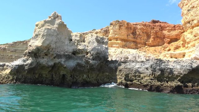 View from a sightseeing boat of the carvoeiro cliffs in a trip to Benagil caves, Algarve, Portugal