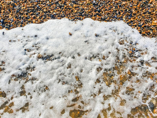 pebbles on british seaside beach on sunny day