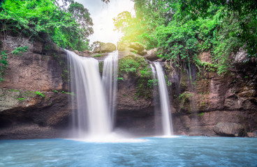 Travel to the beautiful waterfall in deep forest, soft water of the stream in the natural park at Haew Suwat Waterfall at Khao Yai National Park, Thailand