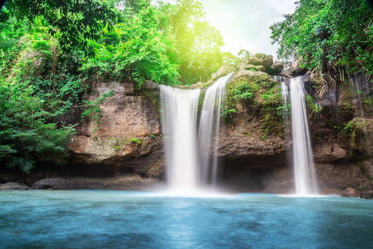 Travel to the beautiful waterfall in deep forest, soft water of the stream in the natural park at Haew Suwat Waterfall at Khao Yai National Park, Thailand