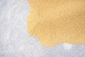 Raw rice crop exposured with sunlight on a white cotton cloth outside the procedure factory before...