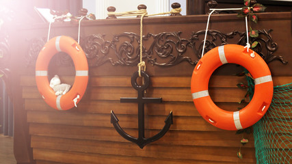 A ring-buoy on a wooden ship