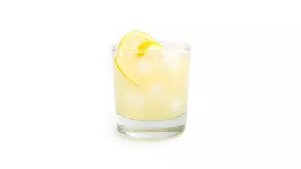 Foto op Plexiglas Glass with lemon lemonade and ice on a white background. . High quality photo © jul_photolover