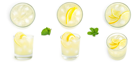 Fototapeta Glass with lemon lemonade and ice on a white background. . High quality photo obraz