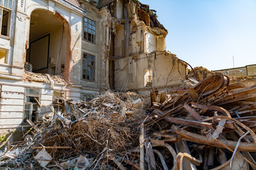 Ruined building. A pile of concrete, rubble and reinforcement debris.